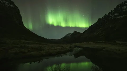 A beautiful reflection of the Aurora Borealis in a mountain river Stock Footage 269714228