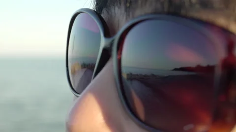 Beautiful reflection of beach and sky on woman's sunglasses. 4K UHD. Stock Footage 52002856