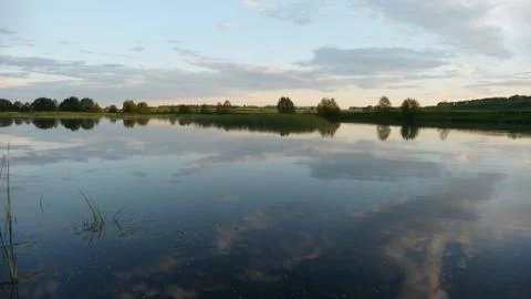 Beautiful reflection of clouds in the Russian river. Stock Photos