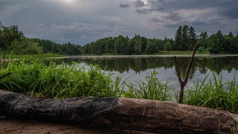 Beautiful reflection of clouds in water surface over lake or pond in the fairy Stock Footage 248408142