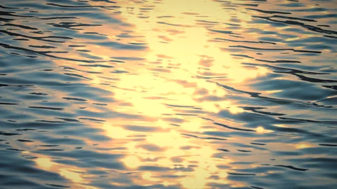 Beautiful reflection golden sun light on blue water, rippled waves. 스톡 동영상 264034230