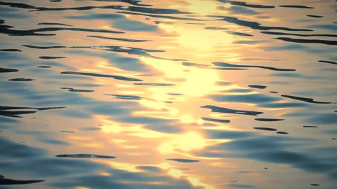 Beautiful reflection golden sun light on blue water, rippled waves. 스톡 동영상 264034331