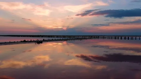 Beautiful reflection of pink sunset in the lake Stock Footage 137995913