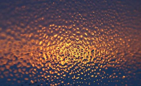 Beautiful reflection of sunrise shining through ice on window after storm Fotos de archivo