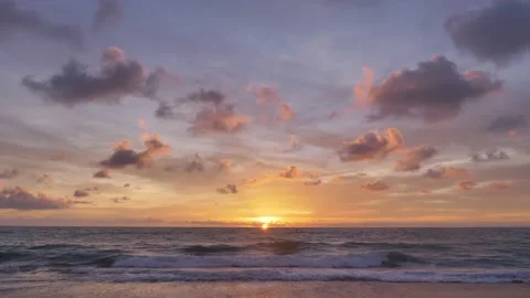 A beautiful reflection of the sunset over the horizon between the sky and the Stock Footage 153275798