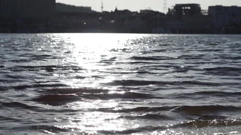 Beautiful reflection of the sunset in the river in the city. Silhouette of city Stock Footage 196121717