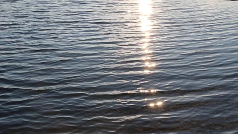 Beautiful reflection of sunset on the water. Video stock 107409957