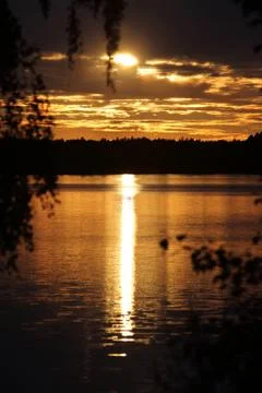 Beautiful reflection of the sunset on the water. One of the most beautiful vi Stock Photos