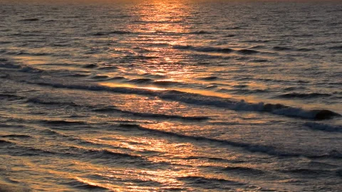 Beautiful reflection sunset on waves sea. Stock Footage 295433905