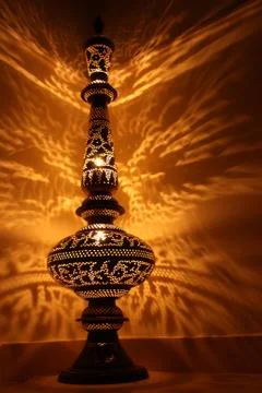 Beautiful reflection on the wall from the lamp Stock Photos