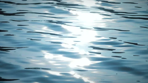 Beautiful reflection white sun light on blue water, rippled waves. Slow motion. 스톡 동영상 251427532