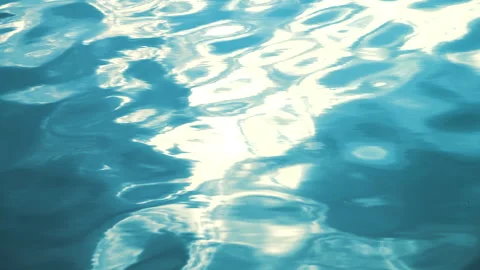 Beautiful reflection white sun light on blue water, rippled waves. 스톡 동영상 264031662