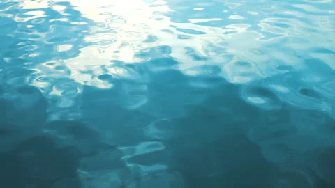 Beautiful reflection white sun light on blue water, rippled waves. Stock Footage 264031944