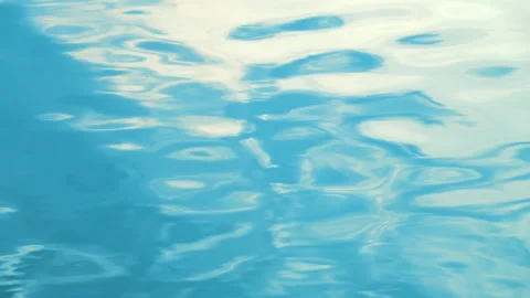 Beautiful reflection white sun light on blue water, rippled waves. 스톡 동영상 264032034