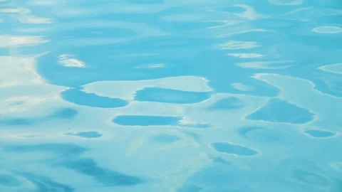 Beautiful reflection white sun light on blue water, rippled waves. 스톡 동영상 264032093