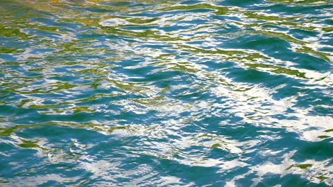 Beautiful reflection white sun light on blue water, rippled waves. 스톡 동영상 264366142