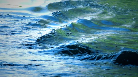 Beautiful reflection white sun light on blue water, rippled waves. 스톡 동영상 264367182