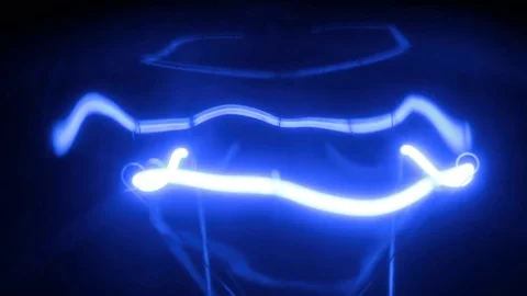 Beautiful reflections and glare of the blue spiral of the incandescent lamp. Stock Footage 81329862