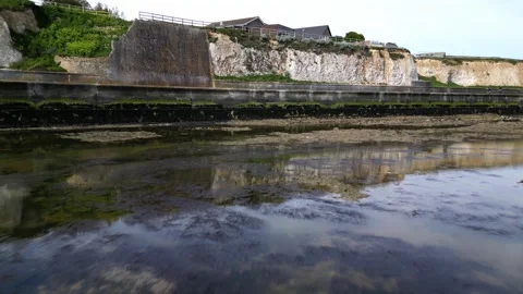 Beautiful reflections flying toward chalk cliff epple bay Stock Footage 245382894