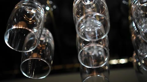 Beautiful reflections of light in glasses hanging above the bar. Close-up Stock Footage 139228832