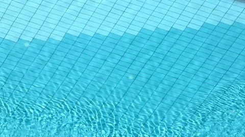 Beautiful refreshing blue swimming pool water Stock Footage