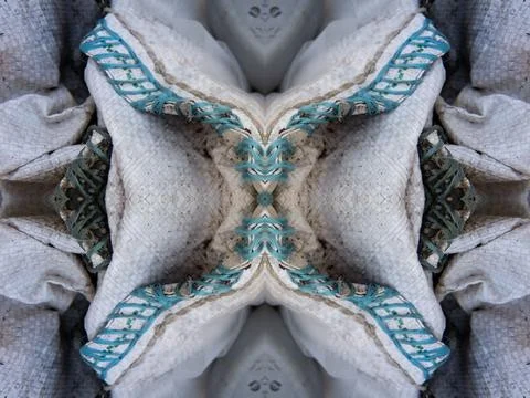 A beautiful repeat pattern formed out of folded tarpaulin with blue stitching 스톡 사진