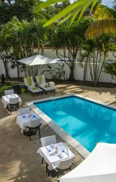 Beautiful resort interiors with pool poolside tables indoor Stock-Fotos