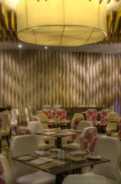 Beautiful restaurant interior design with table seating and lighting and othe Stock Photos