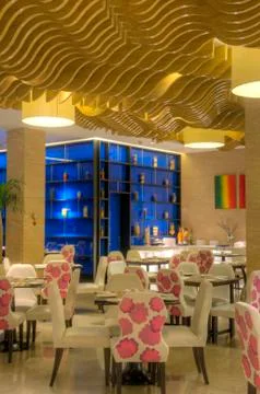 Beautiful restaurant interior design with table seating and lighting and othe Stock Photos