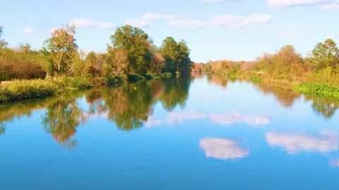 A beautiful river beside a walking trail with people Stock Footage 143665876