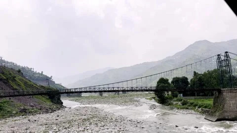 Beautiful River Flowing Through Mountainous Villages with Scenic Landscape Stockbeeldmateriaal 339778297