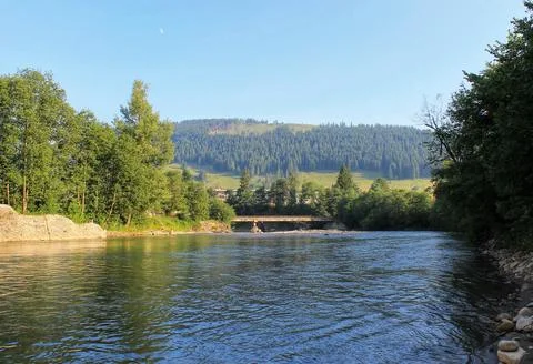 A beautiful river flows in the mountains Stock Photos