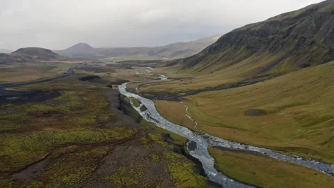 Beautiful river flows through green mountains at dusk Stock Footage 320338576