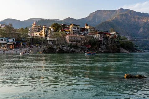 Beautiful River Ganga in Rishikesh surrounded by ashrames and temples build.. Stock Photos
