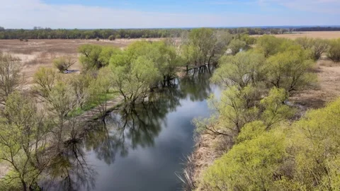 Beautiful river in spring with reflection in water, aerial sunny landscape Stock Footage 152568301