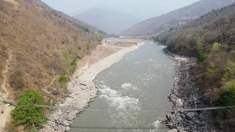 Beautiful river winding through a mountainous landscape Stock Footage 306212396