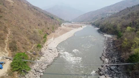 Beautiful river winding through a mountainous landscape Stock Footage 306212408
