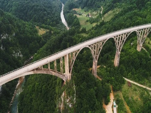 Beautiful road bridge across the river in the mountains. 스톡 동영상 80248971