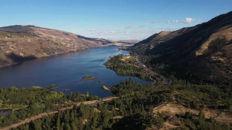 Beautiful road overlooking a large valley during sunset Stock Footage 167106926
