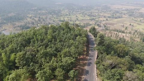 Beautiful road passing through forest and mountain hills. Stock Footage 255365585