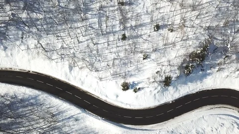 Beautiful road in winter, top down view of car Stock Footage 102693149