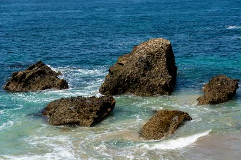 Beautiful Rock Outcropping in the Shallows of the Pacific Ocean Stock Photos