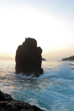 Beautiful rocky beach of East Java, Indonesia in the late afternoon. Low li.. Stock Photos