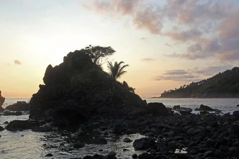 Beautiful rocky beach of East Java, Indonesia in the late afternoon. Low li.. Stock Photos