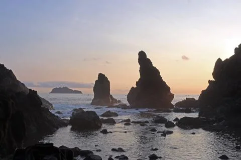 Beautiful rocky beach of East Java, Indonesia in the late afternoon. Low li.. Stock Photos