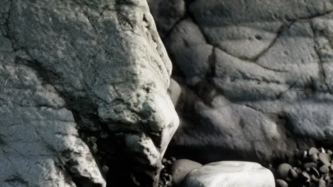 Beautiful Rocky Texture Along a Quiet Pebble Beach at Sunset Stock Footage 344822904