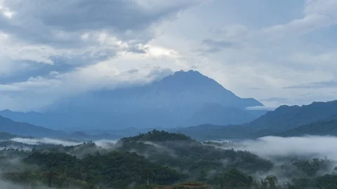 Beautiful Rolling Clouds Drifting Over and heavy foggy during morning sunrise Stock Footage 122651144
