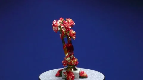 A beautiful romantic composition with flowers and a heart rotates Stock Footage 168668372