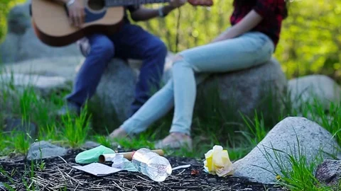 Beautiful romantic couple around garbage dump having fun in the forest. Slow Stock Footage 76009358