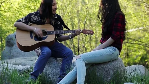 Beautiful romantic couple around garbage dump having fun in the forest. Slow Stock Footage 76009361